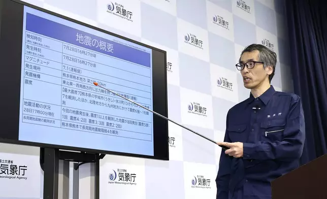 An official at the Japan Meteorological Agency speaks during a news conference in Tokyo, Tuesday, July 28, 2026, following an earthquake in Kumamoto in the Kyushu island, southern Japan. (Masanori Kumagai/Kyodo News via AP)