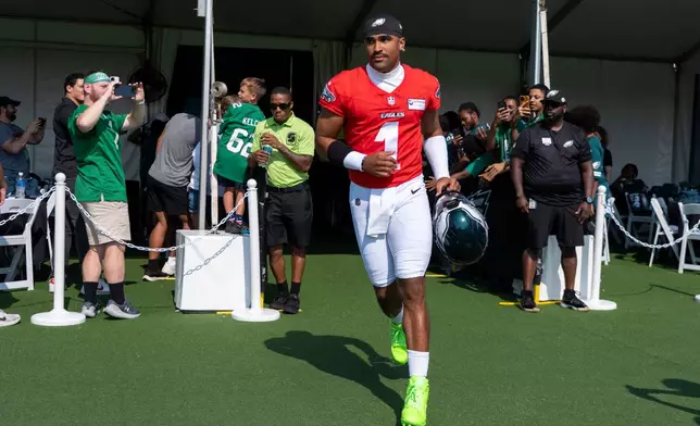 Philadelphia Eagles quarterback Jalen Hurts (1) takes to the field during practice at the team's NFL football training camp in Philadelphia, Wednesday, July 29, 2026. (AP Photo/Chris Szagola)