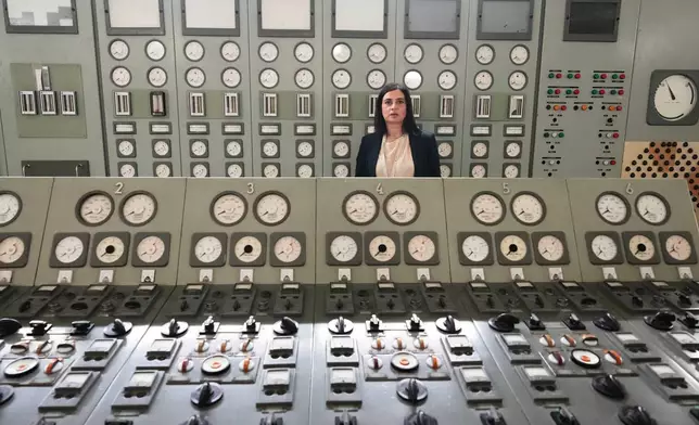 Viviana Cruciani, who oversees nuclear decommissioning of the former nuclear power plant of Latina, Italy, poses for a photo in the old control room during an interview with The Associated Press in Latina, Thursday, June 18, 2026. (AP Photo/Alessandra Tarantino)