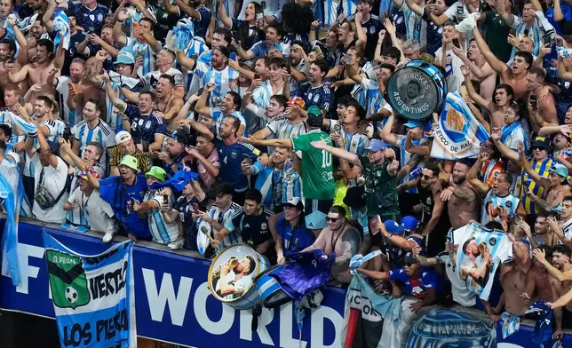 Fans of Argentina celebrate after they defeated England in their World Cup semifinal soccer match in Atlanta, Wednesday, July 15, 2026. (AP Photo/Lynne Sladky)