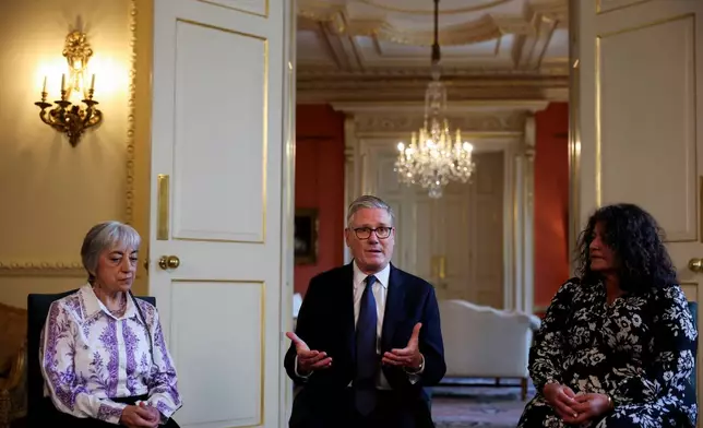 Britain's Prime Minister Keir Starmer, center, attends a meeting with campaigners to discuss historical forced adoption, at Downing Street, in London, Thursday July 2, 2026. (Isabel Infantes/Pool Photo via AP)