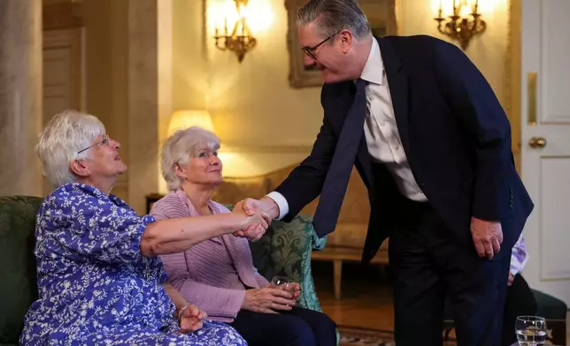 Britain's Prime Minister Keir Starmer meets with campaigners to discuss historical forced adoption, at Downing Street, in London, Thursday July 2, 2026. (Isabel Infantes/Pool Photo via AP)