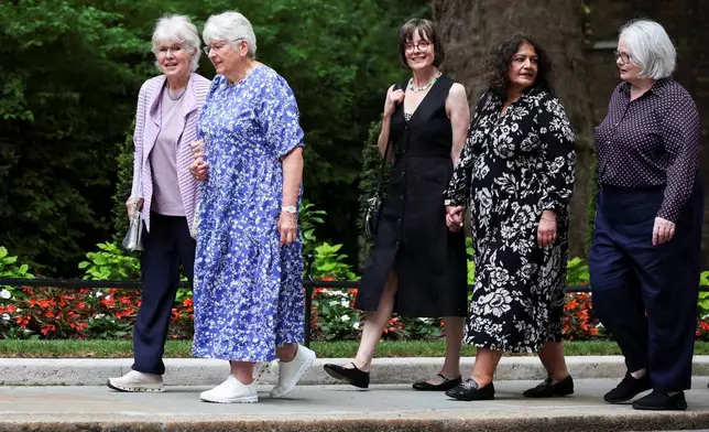 Campaigners arrive for a meeting with Britain's Prime Minister Keir Starmer at Downing Street, to discuss historical forced adoption, in London, Thursday July 2, 2026. (Isabel Infantes/Pool Photo via AP)