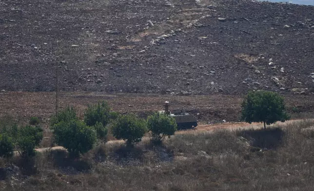 A Lebanese army armored personnel carrier deploys at the entrance to the southern village of Zawtar Al Gharbieh, Lebanon, Wednesday, July 22, 2026. (AP Photo/Mohammed Zaatari)