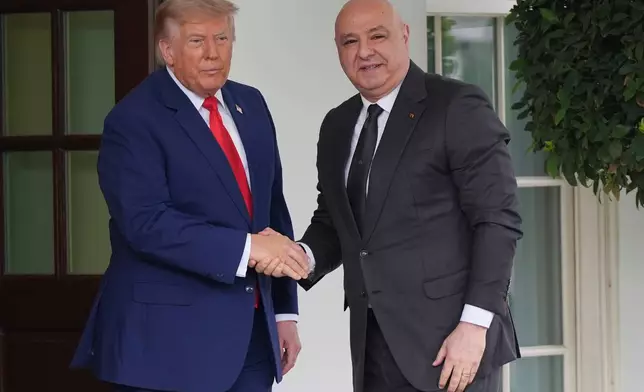 President Donald Trump greets Lebanon's President Joseph Aoun on his arrival at the White House, Tuesday, July 21, 2026, in Washington. (AP Photo/Julia Demaree Nikhinson)