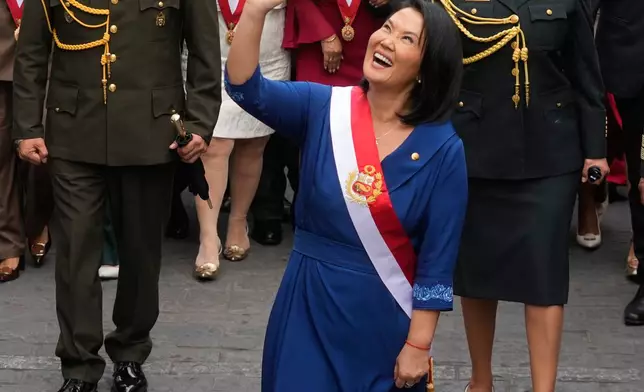 Peru's President Keiko Fujimori walks to the presidential palace after her inauguration in Lima, Peru, Tuesday, July 28, 2026. (AP Photo/Martin Mejia)