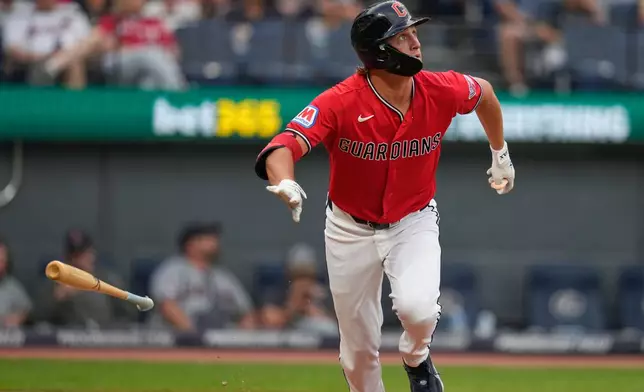 Cleveland Guardians' Petey Halpin drops his bat as he watches his home run in the fourth inning of a baseball game against the Minnesota Twins in Cleveland, Monday, July 20, 2026. (AP Photo/Sue Ogrocki)