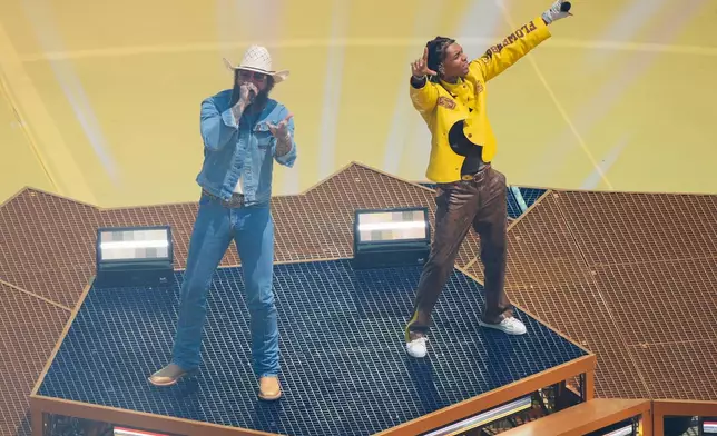 Singer Post Malone, left and Swae Lee perform prior to the World Cup final soccer match between Spain and Argentina in East Rutherford, N.J., near New York, Sunday, July 19, 2026. (AP Photo/Yuki Iwamura)