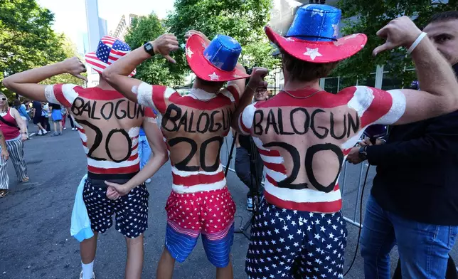 United States fans show their support for Folarin Balogun as they parade near the stadium before the World Cup round of 16 soccer match against Belgium in Seattle, Monday, July 6, 2026. (AP Photo/Ted S. Warren)