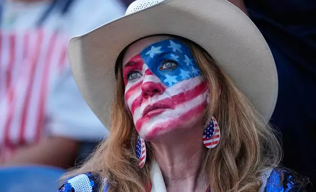 A United States fan reacts following the World Cup round of 16 soccer match between the United States and Belgium in Seattle, Monday, July 6, 2026. (AP Photo/Lindsey Wasson)