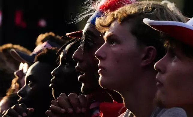 Fans watch a World Cup round of 16 soccer match between the United States and Belgium at the KC Live! entertainment district Monday, July 6, 2026, in Kansas City, Mo. (AP Photo/Charlie Riedel)