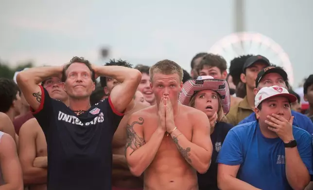 People react after Belgium scored during the World Cup round of 16 soccer match between the United States and Belgium, Monday, July 6, 2026, at the FIFA Fan Zone on the National Mall in Washington. (AP Photo/Rod Lamkey, Jr.)