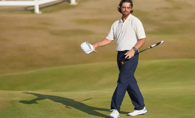 Tommy Fleetwood of England reacts to the crowd on the 18th green after completing his third round during the third day of the British Open Golf championships at Royal Birkdale golf club, in Southport, England, Saturday, July 18, 2026. (AP Photo/Jon Super)