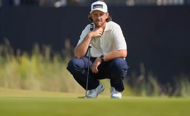 Tommy Fleetwood of England looks at the lie of his putt on the 9th green during the third day of the British Open Golf championships at Royal Birkdale golf club, in Southport, England, Saturday, July 18, 2026. (AP Photo/David Goldman)