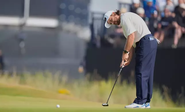 Tommy Fleetwood of England putts on the 9th green during the third day of the British Open Golf championships at Royal Birkdale golf club, in Southport, England, Saturday, July 18, 2026. (AP Photo/David Goldman)