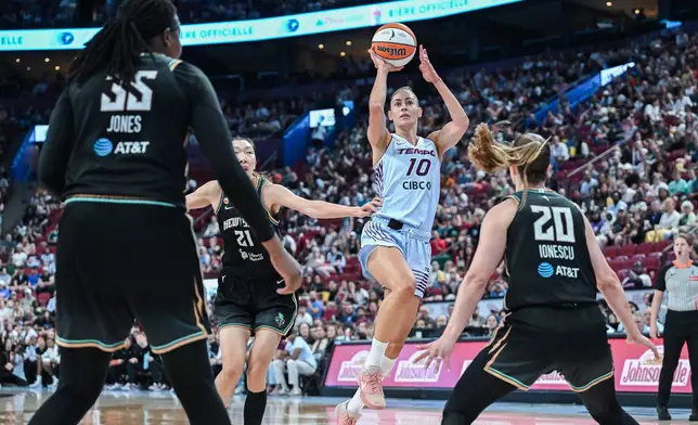 Toronto Tempo's Maria Conde (10) looks to shoot in the paint during the first half of a WNBA basketball game against the New York Liberty in Montreal, Sunday, July 12, 2026. (Graham Hughes/The Canadian Press via AP)