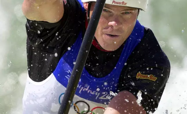 FILE - American David Hearn, of Bethesda, Md., makes his way through the C1 slalom course, Sept. 17, 2000, at Whitewater Stadium in Penrith, Australia. (AP Photo/Koji Sasahara, File)