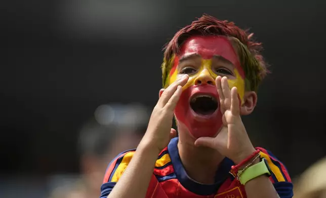 A Spanish fan cheers before the World Cup quarterfinal soccer match between Spain and Belgium in Inglewood, Calif., near Los Angeles, Friday, July 10, 2026. (AP Photo/Andre Penner)