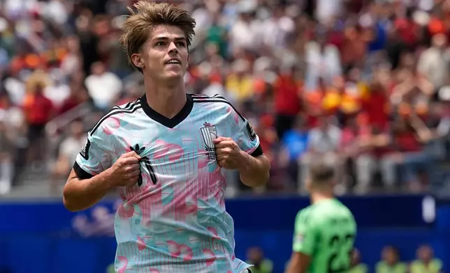 Belgium's Charles De Ketelaere (17) celebrates scoring their first goal during the World Cup quarterfinal soccer match between Spain and Belgium in Inglewood, Calif., near Los Angeles, Friday, July 10, 2026. (AP Photo/Gregory Bull)