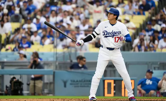 Los Angeles Dodgers' Shohei Ohtani prepares to bat during the fifth inning of a baseball game against the Arizona Diamondbacks in Los Angeles, Sunday, July 12, 2026. (AP Photo/Kyusung Gong)