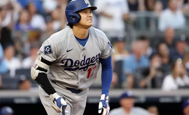 Los Angeles Dodgers designated hitter Shohei Ohtani reacts while watching his flyout during the third inning of a baseball game against the New York Yankees, Friday, July 17, 2026, in New York. (AP Photo/Adam Hunger)