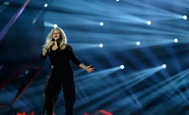 FILE - Singer Bonnie Tyler performs her song "Believe in Me" during a rehearsal for the final of the Eurovision Song Contest at the Malmo Arena in Malmo, Sweden on May 17, 2013. (AP Photo/Alastair Grant, File)