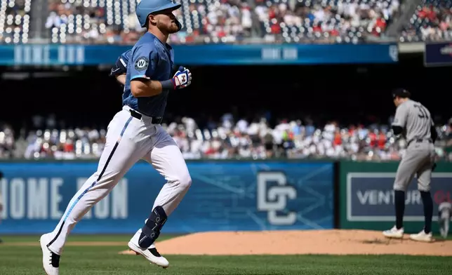 Washington Nationals' Curtis Mead, left, rounds the bases on his solo home run off New York Yankees pitcher Cam Schlittler (31) during the first inning of a baseball game Saturday, July 11, 2026, in Washington. (AP Photo/Nick Wass)