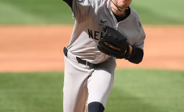 New York Yankees pitcher Cam Schlittler throws during the second inning of a baseball game against the Washington Nationals, Saturday, July 11, 2026, in Washington. (AP Photo/Nick Wass)