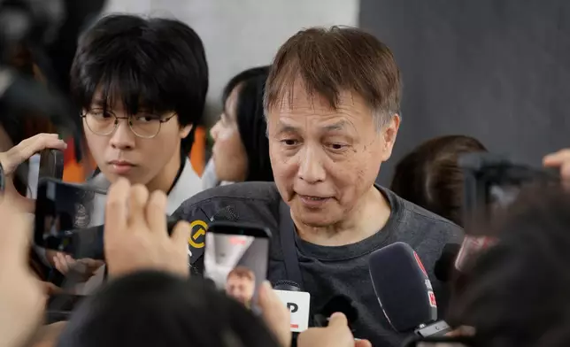 Lee Kwok-hung, speaks to the media following the closing submissions at the hearing of an independent committee investigating last year's Tai Po fire, in Hong Kong, Friday, July 17, 2026. (AP Photo/May James)