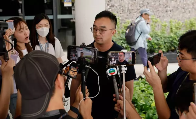 Patrick Liu speaks to the media following the closing submissions at the hearing of an independent committee investigating last year's Tai Po fire, in Hong Kong, Friday, July 17, 2026. (AP Photo/May James)
