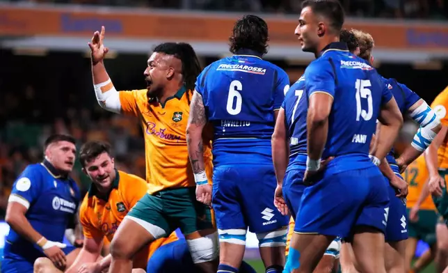 Australia's Brandon Paenga-Amosa, third left, celebrates scoring a try against Italy during their Nations Championship rugby international test match in Perth, Australia, Saturday, July 18, 2026. (AP Photo/Gary Day)