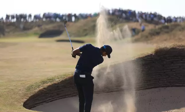 Aaron Rai of England plays out of a bunker not he 110th hole during the first day of the British Open Golf championships at Royal Birkdale golf club, in Southport, England, Thursday, July 16, 2026. (AP Photo/Peter Morrison)