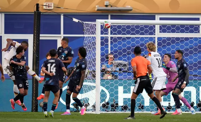 Germany's Jonathan Tah, left, scores a goal later disallowed during the World Cup round of 32 soccer match between Germany and Paraguay in Foxborough, Mass., near Boston, Monday, June 29, 2026. (AP Photo/Charles Krupa)