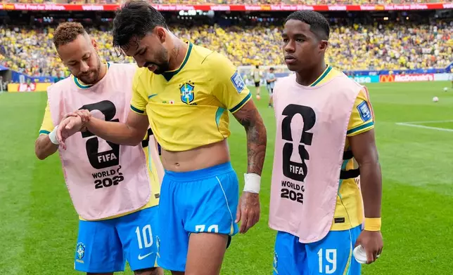 Brazil's Lucas Paqueta (20) is assisted at the half time during the World Cup round of 32 soccer match between Brazil and Japan in Houston, Monday, June 29, 2026. (AP Photo/David J. Phillip)