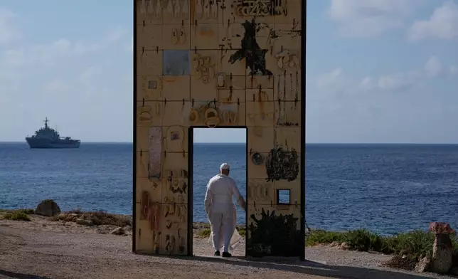 Pope Leo XIV visits the Gateway of Europe monument in Lampedusa, Sicily, southern Italy, Saturday, July 4, 2026, during a one-day pastoral visit to the island long associated with the plight of migrants crossing the Mediterranean. (AP Photo/Alessandra Tarantino)