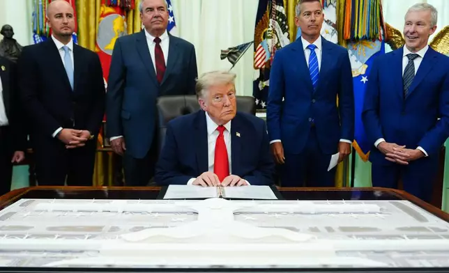 President Donald Trump speaks about Dulles International Airport modernization, in the Oval Office of the White House, Wednesday, July 29, 2026, in Washington. (AP Photo/Julia Demaree Nikhinson)