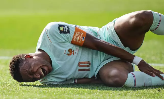France's Kylian Mbappe (10) reacts to being tripped during the World Cup quarterfinal soccer match between France and Morocco in Foxborough, Mass., near Boston, Thursday, July 9, 2026. (AP Photo/Stephanie Scarbrough)