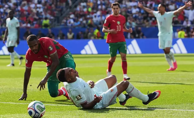France's Kylian Mbappe (10) reacts to being tripped by Morocco's Issa Diop, left, during the World Cup quarterfinal soccer match between France and Morocco in Foxborough, Mass., near Boston, Thursday, July 9, 2026. (AP Photo/Stephanie Scarbrough)