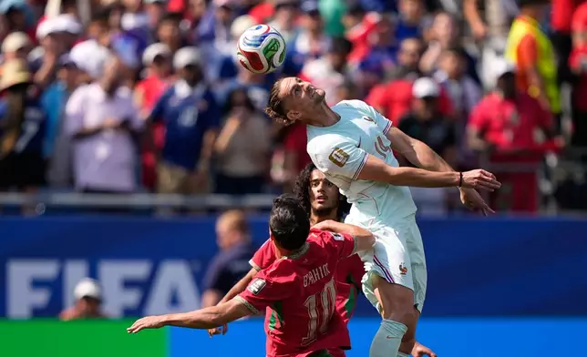 France's Adrien Rabiot heads the ball above Morocco's Brahim Diaz during the World Cup quarterfinal soccer match between France and Morocco in Foxborough, Mass., near Boston, Thursday, July 9, 2026. (AP Photo/Matt Slocum)