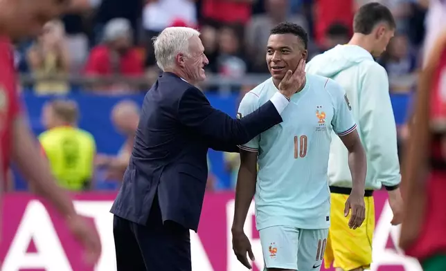 France head coach Didier Deschamps celebrates with France's Kylian Mbappe at the end of the World Cup quarterfinal soccer match between France and Morocco in Foxborough, Mass., near Boston, Thursday, July 9, 2026. (AP Photo/Matt Slocum)