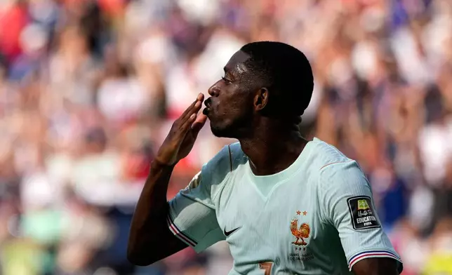 France's Ousmane Dembele celebrates after scoring his side's second goal during the World Cup quarterfinal soccer match between France and Morocco in Foxborough, Mass., near Boston, Thursday, July 9, 2026. (AP Photo/Matt Slocum)