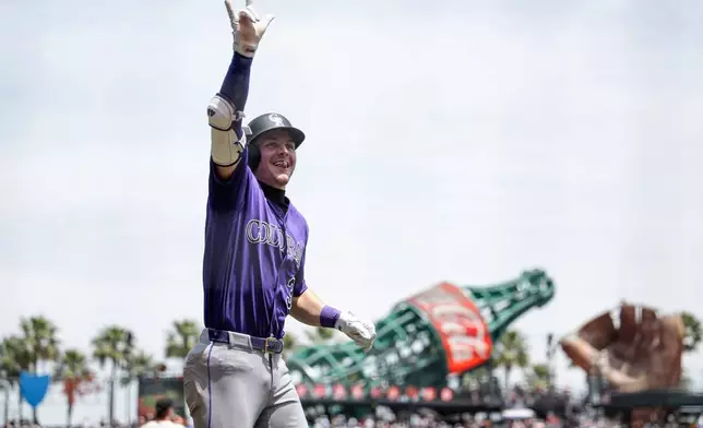 Colorado Rockies' Jake McCarthy reacts after scoring during the first inning of a baseball game against the San Francisco Giants, Sunday, July 12, 2026, in San Francisco. (AP Photo/Thien-An Truong)