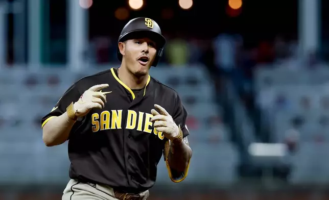 San Diego Padres' Manny Machado reacts while rounding the bases after hitting a solo home run against the Atlanta Braves during the sixth inning of a baseball game, Tuesday, July 21, 2026, in Atlanta. (AP Photo/Erik S. Lesser)