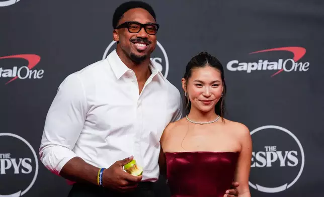 Myles Garrett, left, and Chloe Kim arrive at the ESPY Awards at Lincoln Center on Wednesday, July 15, 2026, in New York. (AP Photo/Yuki Iwamura)