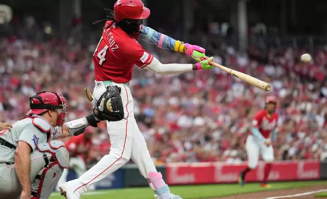 Cincinnati Reds' Elly de la Cruz hits a two-run homer during the fourth inning of a baseball game against the Philadelphia Phillies in Cincinnati, Wednesday, July 8, 2026. (AP Photo/Carolyn Kaster)