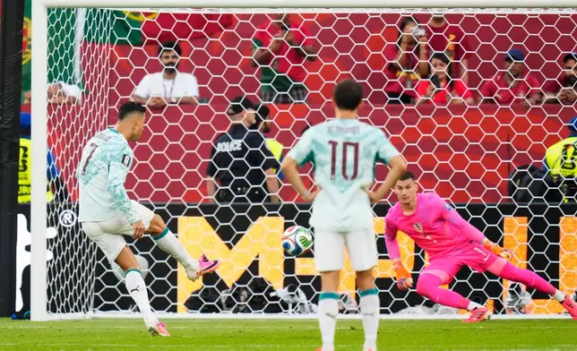 Portugal's Cristiano Ronaldo (7) scores on a penalty kick past Croatia goalkeeper Dominik Livakovic (1) during the World Cup round of 32 soccer match between Portugal and Croatia in Toronto, Thursday, July 2, 2026. (Chris Young/The Canadian Press via AP)