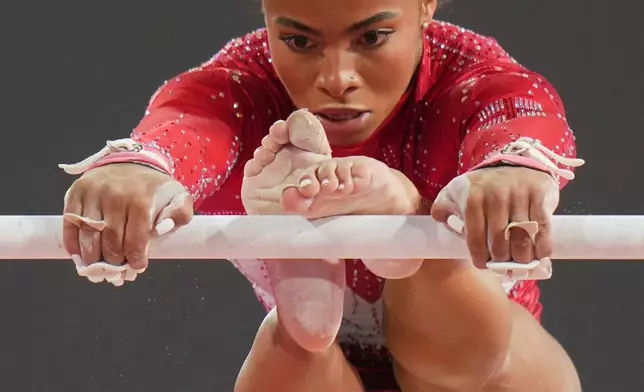 England's Alia Leat competes on the uneven bars during the women's team final and individual qualification of Artistic Gymnastics at the Commonwealth Games in Glasgow, Scotland, Saturday, July 25, 2026. (AP Photo/Kin Cheung)