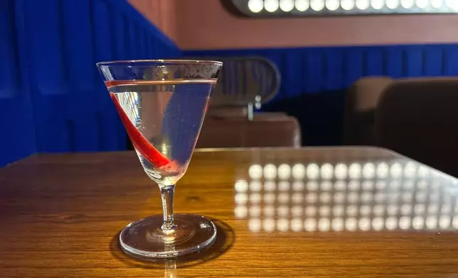 A spicy cocktail called Late Night, made with a brine mix of onion, olive, and sivri pepper, is displayed in London on June 24, 2026. (AP Photo/Louise Dixon)