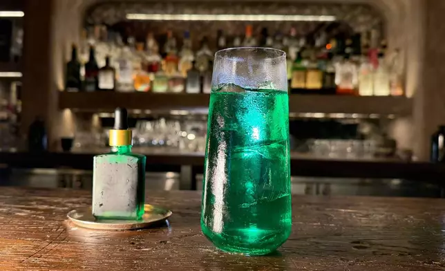 A spicy cocktail called Green Doctor, made with tomatillo, green apple, shiso, and horseradish, is displayed in New York on June 23, 2026. (AP Photo/Guido Neira)