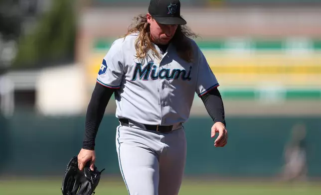 Miami Marlins pitcher Lake Bachar walks off the mound after being pulled during the eighth inning of a baseball game against the Athletics, Sunday, July 5, 2026, in West Sacramento, Calif. (AP Photo/Scott Marshall)
